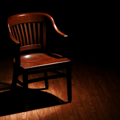 Empty Chair in Spotlight